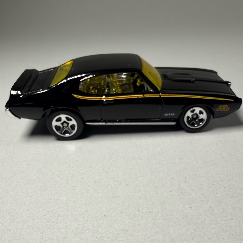 Hot Wheels ‘69 Pontiac GTO. Black w Yellow tint glass Die-Cast 1:64